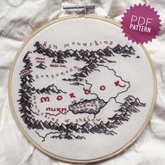 a cross stitch map with mountains and lakes on it is featured in the pattern for this project