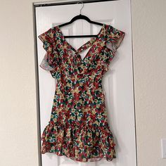 Zip In The Back. Size Small. Fits Like A Xs/S. I’m 5’6 And Is Short On Me. Lays A Little Above Mid Thigh. Sleeveless Ruffled Mini Dress For Holiday, Short Sleeve Dresses With Ruffles For Holiday, Short Sleeve Holiday Dresses With Ruffles, Holiday V-neck Ruffled Mini Dress, Holiday Dresses With Short Sleeves And Ruffles, Holiday Floral Sundress Mini Dress, Holiday Floral Print Sundress, Open Back Dress, Open Back Dresses