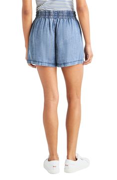 Take it easy in these summery chambray shorts topped with an elastic waist and a dainty drawstring. 2 1/2" inseam; 26" leg opening; 11" front rise; 15" back rise Elastic/drawstring waist Front slant pockets 100% lyocell Machine wash, tumble dry Imported Relaxed Summer Bottoms With Pull-on Style, Relaxed Fit Pull-on Beach Shorts, Summer Denim Shorts With Short Inseam, Summer Denim Bottoms With Drawstring, Summer Drawstring Denim Bottoms, Denim Shorts With Short Inseam For Summer, Adjustable Drawstring Bottoms For Vacation, Vacation Relaxed Fit Pull-on Shorts, Summer Beach Shorts With Pull-on Style