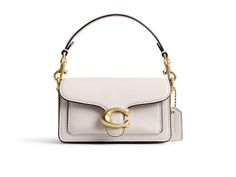 COACH Tabby 12 - Cross Body Handbags : Chalk : Please Note: COACH items cannot be shipped to military addresses (APO or FPO) and addresses in Hawaii, the Virgin Islands, Guam or any other locations outside of the continental US. Unleash your style with the COACH TABBY 12, a masterpiece of glovetanned leather luxury. Elevate your everyday with its sleek design, featuring zip and multifunction pockets for effortless organization. The snap closure and detachable handle offer versatility, while the outside open pocket adds practicality. Three slip pockets on the inside. Brand logo on the front. Fabric lining. Imported. Measurements: Bottom Width: 1 3 4 in Height: 3 in Strap Drop: 21 1 2 in Handle Drop: 2 3 4 in Coach Tabby, The Virgin Islands, Coach Tote Bags, Coach Tote, Back Bag, Coach Shoulder Bag, Metallic Bag, Virgin Islands, Fur Boots