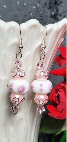 Earrings Pink Swarovski Crystals, White Lampworks Beads with Pink Polka Dots, Pink Pearls with Silver Decorative Bead Caps, Silver Hardware. They hang approx 1 1/2in. White Faceted Beads Beaded Earrings Gift, White Faceted Beaded Earrings As A Gift, White Bead Caps Earrings For Gift, Pink Beaded Czech Glass Jewelry, White Beaded Earrings With Spacer Beads For Gift, Adjustable White Beaded Earrings With Faceted Beads, Whimsical White Round Jewelry, Pink Round Jewelry With Bead Caps, Pink Dangle Beaded Earrings With Spacer Beads