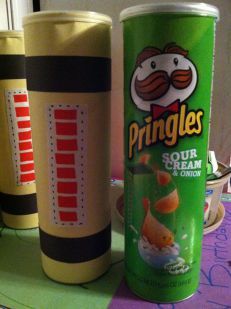 two cans of pringles are sitting on a table