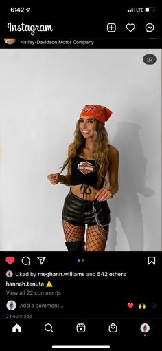 a woman wearing fishnet stockings and a red bandana on her head standing in front of a white wall