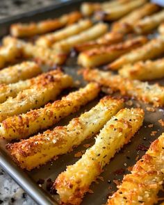 baked french fries on a baking sheet ready to be eaten