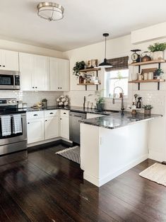 the kitchen is clean and ready for us to use in its new owner's home