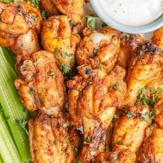 chicken wings and celery with ranch dressing on the side