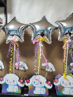 balloons and streamers are on display at a birthday party with elephant themed decorations,