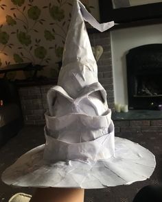 a white paper hat sitting on top of a table