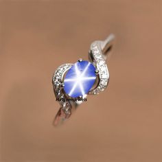 Star-shaped Birthstone Promise Ring, Star-shaped Birthstone Jewelry For Promise Ring, Celestial Style Silver Sapphire Ring For Anniversary, Star-shaped Silver Sapphire Promise Ring, Star Shaped Sapphire Jewelry For Anniversary, Silver Star-shaped Crystal Ring For Anniversary, Star-shaped Sapphire Rings For Anniversary, Celestial Star Sapphire Ring For Anniversary, Sapphire Ring Engagement