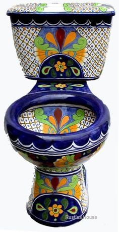 three bowls are stacked on top of each other in blue and green designs, one with an ornate design