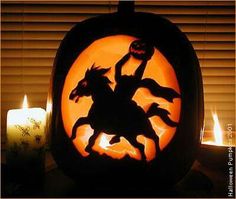 a pumpkin carved to look like a horse and rider