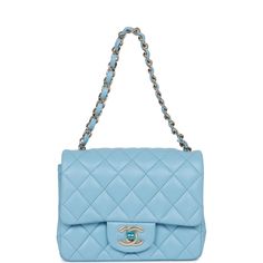 This Mini Square flap bag is in blue lambskin with light gold tone hardware and has a front flap with signature CC turnlock closure, rear half moon pocket and single interwoven blue leather and light gold tone chain link shoulder/crossbody strap. The interior is lined in blue leather and features a zipper pocket with Chanel pull and an open pocket below. Collection: 22S Origin: France Condition: Pristine; new or never Accompanied by: Chanel box, Chanel dustbag, carebook, ribbon, felt Measurements: 6.5" width x 5" depth x 3" height; 22" strap drop Chanel Mini Square, Chanel Box, Chanel Mini, Trending Handbag, Dior Shoes, Somali, Vuitton Bag, Sierra Leone, Fendi Bags