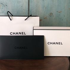 A Great Little Gift Box, For Your Bff Or Yourself, That Measures 8-1/2” X 5-1/2” X 2-7/8” And Is Filled With Chanel Tissue Paper, White Shredded Nesting Paper, And A Chanel Seal. The Tote Shopping Bag Measures 10” X 7-3/4” X 3” And The Gift Box Fits Inside Perfectly. There Is Also A Black Open-End Envelope, Measuring 8” X 4-1/2” And Has “Chanel” Embossed On The Front, Good For A Card Or A Note. Coco Chanel Gift Bags, Note Card, Bago, Tissue Paper, Little Gifts, Note Cards, Envelope, Gift Box, Chanel