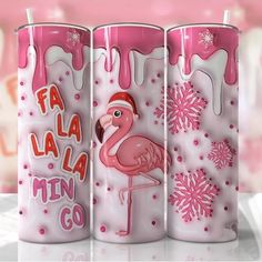 three pink candles with flamingos and snowflakes on them