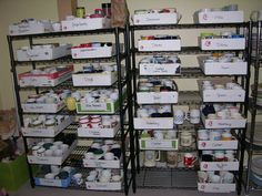 two shelving racks filled with cups and mugs