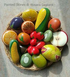 a basket filled with fruit and vegetables on top of a table