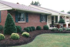 a house with landscaping in the front yard