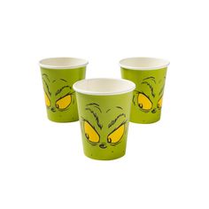 three green cups with yellow faces on them