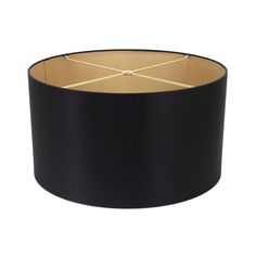 a black lamp shade with gold trim