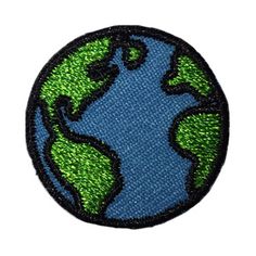 an embroidered patch with the earth in green and blue colors on it's side