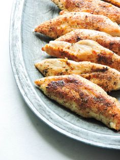 several pieces of chicken sitting on a plate