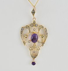 Description  Antique Victorian 9ct gold amethyst lavalier pendant, c1880. 9ct Gold open work lavalier pendant with oval cut milgrain set amethyst to the center & adorned with seed pearls in a foliate design, to the bottom of the pendant a round cut claw set amethyst hangs on it's own loop. To the top, the pendant has a decorative chain loop claw set with two seed pearls. Stamped 9ct to verso. With gift box. A fantastic addition to any collection. Ultrasonically cleaned. Chain not included. Please study the photographs carefully as they form part of the overall description.   Date c1880 Weight 2.43 grams    Dimensions of pendant 52mm x 23mm Condition. Excellent condition. Antique Engraved Purple Jewelry, Purple Filigree Pendant Jewelry, Antique Amethyst Pendant Jewelry, Victorian 14k Gold Purple Jewelry, Antique Purple Jewelry With Intricate Design, Victorian Purple Necklace For Anniversary, Victorian Gemstone Pendant Jewelry, Victorian Pendant Gemstone Jewelry, Antique Amethyst Yellow Gold Jewelry