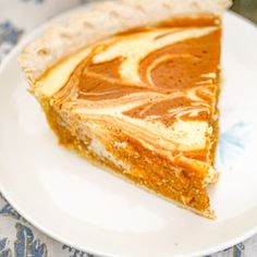 a slice of pumpkin pie on a white plate