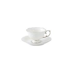 a white cup and saucer sitting on top of each other