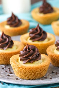 small cupcakes with chocolate frosting on a plate