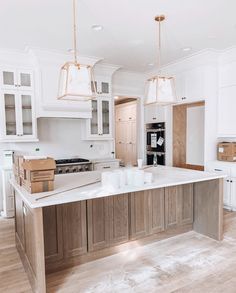 an instagram photo of a kitchen with wooden cabinets and white countertops that is being used as a postcard