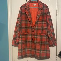 Super Cute Orange And Brown Plaid Jacket. Two Button Front With Faux Welt Pockets. Full Quilted Interior. Size Large. Shoulder To Hem 36”. Shoulder To Shoulder 17” Fall Orange Single Breasted Blazer, Orange Single-breasted Blazer For Fall, Fall Long Coat Blazer With Snap Buttons, Casual Orange Blazer For Work, Fall Orange Blazer With Pockets, Casual Orange Outerwear With Buttons, Casual Orange Blazer For Winter, Trendy Orange Outerwear With Button Closure, Casual Orange Fall Blazer