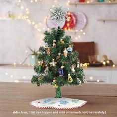 a small christmas tree with ornaments on it