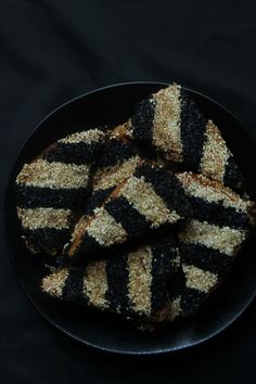 black and white striped cookies on a plate