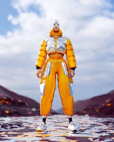 a man in an orange and white suit standing on water