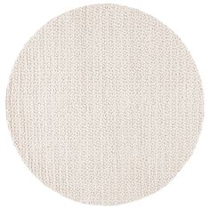 a round rug with white knitted fabric on the bottom, and an oval pattern in the middle