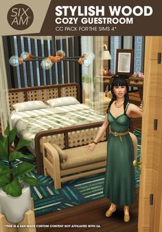 a woman in a green dress standing next to a bed