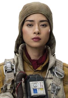 a woman in a star wars outfit holding a remote control and looking at the camera