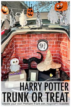 harry potter trunk or treat with halloween decorations on the top and an owl figurine