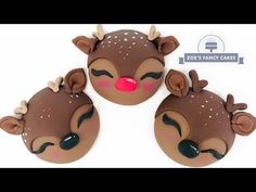 three brown and white reindeer head cakes with red noses