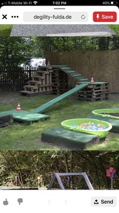 an image of a backyard with toys in the yard and on the lawn, there is a slide that has been built into some wood pallets