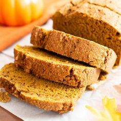 sliced loaf of pumpkin bread sitting on top of a cutting board