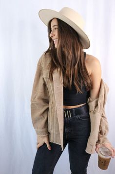 Brunette girl models buttoned corduroy jacket in the color tan for Scarlette The Label, an online fashion boutique for women. The corduroy jacket is an oversized street style jacket. Paired with a black crop top, dark denim jeans, and a wide-brimmed rancher hat. Corduroy Outfits, Corduroy Jacket Outfit, Oversized Street Style, Street Style Jacket, Shacket Outfit, House Pictures, Tan Coat, Tan Jacket, Fall Clothing