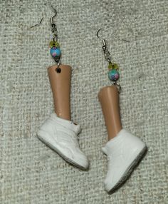 Upcycled Barbie calves with white sneakers made into unique earrings that will be to topic of conversation for sure. Barbie Head Earrings, White Sporty Sneakers, Face Earrings, Doll Head, Upcycled Jewelry, White Sneakers, Unique Earrings, Clay Earrings, Barbie Dolls