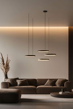 a living room filled with lots of furniture next to a tall wall mounted light fixture