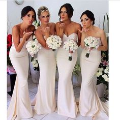 the bridesmaids are all dressed in white dresses