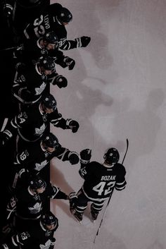 the hockey players are lined up in a huddle