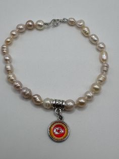 9.5 inch KC Chiefs bracelet with freshwater pearls. Chiefs Bracelet, Kc Chiefs, Charm Bracelets, Freshwater Pearls, Jewelry Bracelets, Charm Bracelet, Ships, Bracelet, Silver