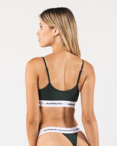 HIGHLIGHTS. Stretchy cotton material. Low impact. Rounded camisole neckline. Easily adjustable straps. Reinforced binding arm and neckline finishing. Custom jacquard waistband with knitted in Alphalete wordmark. Double layered bra construction FIT SUGGESTION. This item runs true to Alphalete’s standard fit.. If you are between sizes, we recommend sizing up for a relaxed fit.. Model is 5’8”/1172cm, wearing a size XS with a 31”/78.7cm bust. MATERIALS AND WASHING DIRECTIONS. 46.5% Cotton, 46.5% Mod Neckline Finishing, Bra Construction, Cotton Material, Bralette, Adjustable Straps, Outfit Ideas, Fashion Inspo, Relaxed Fit, Bra