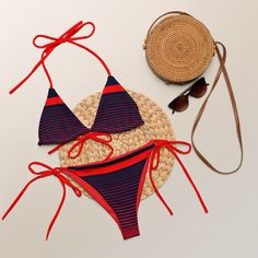 Stay comfortable and beach ready all summer in this FYC String Bikini set. It’s made from soft recycled polyesterwith double-layering and UPF 50+. Style the straps how you like, and get ready to swim! 🏊‍♀️ 🌟 Features: Soft and stretchy material with UPF 50+ protection. Available in sizes up to 4XL. Bikini top comes with removable padding for comfort. Multiple ways to tie and style the bikini set. 🌊 Disclaimer: To make your All-Over Print Recycled String Bikini last longer, thoroughly rinse it Seamless Nylon Tankini For The Beach, Summer Nylon Tankini With Tie-side Bottom, Red Nylon Swimwear For The Beach, Red Nylon Swimwear For Beach, Nylon Swimwear For Sunbathing In Summer, Sporty Seamless Swimwear For Vacation, Summer Nylon Tankini With Triangle Top, Summer Triangle Top Swimwear In Nylon, Sporty Swimwear With Uv Protection For Vacation