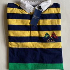 100% Authentic Mens Polo Ralph Lauren Striped Long Sleeve Rugby Shirt (Msrp $198). This Shirt Is Brand New With Tags! Color: Chrome Yellow Multi Even Vented Hem Three-Button Placket " R.L.Y.C" And Flag Patches Embroidered At The Left Chest Twill Rugby Collar Long Sleeves With Ribbed Cuffs Classic Fit 100% Cotton Yellow Polo Collar Shirt For Summer, Yellow Polo Collar Top For Spring, Fitted Yellow Top With Polo Collar, Casual Yellow Polo Collar Shirt, Yellow Cotton Polo Collar Shirt, Yellow Cotton Polo Collar Top, Casual Yellow Top With Striped Collar, Classic Fitted Yellow Top, Classic Yellow Fitted Top